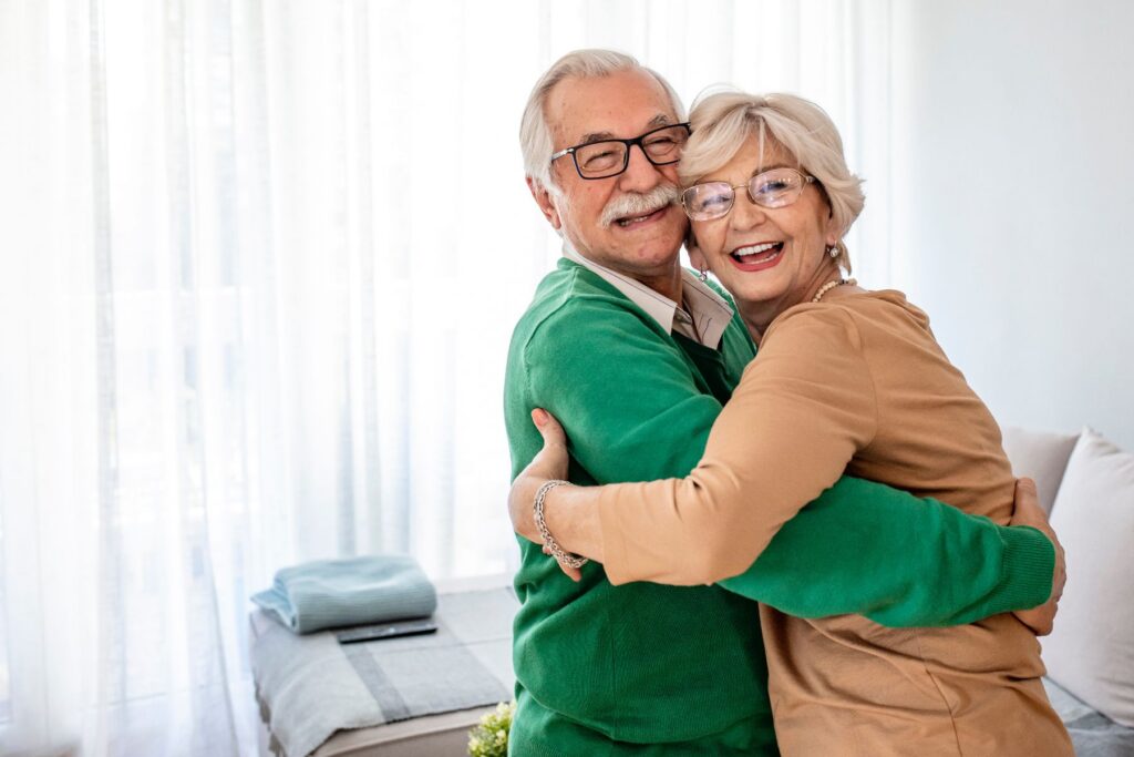 A happy couple discovering why low-maintenance senior living is one of the most freeing choices they made.